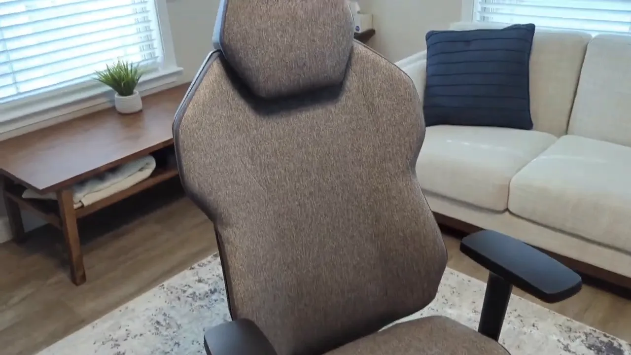 Quersus ICOS chair profile showing headrest, back shape, fabric texture, and armrests