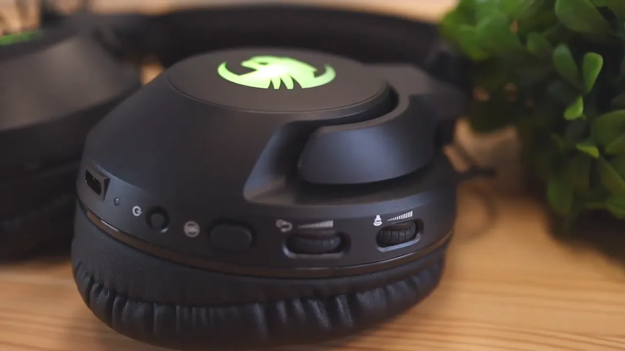 Close-up of headset earcup showing buttons wheel and USB-C charging port