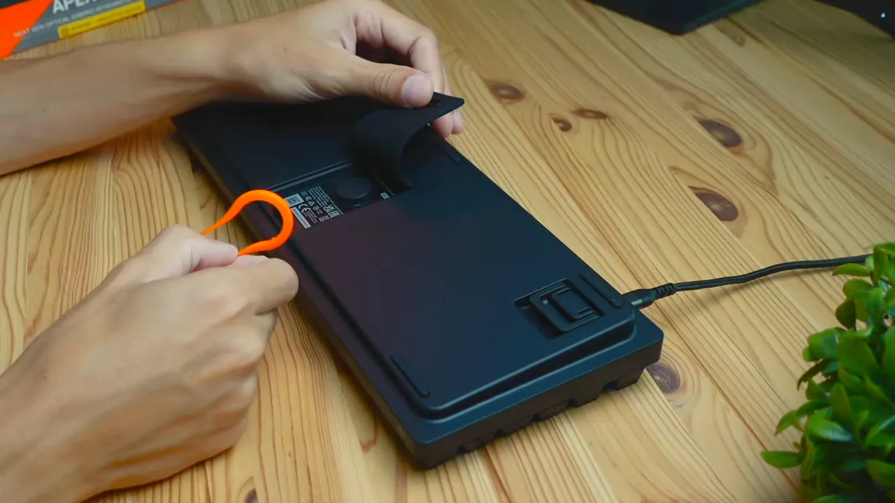 Back of the keyboard with storage compartment open