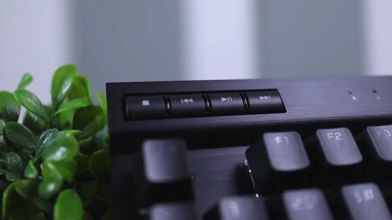 Top bar of the CORSAIR K70 RGB TKL showing small profile/lighting buttons and nearby F-keys