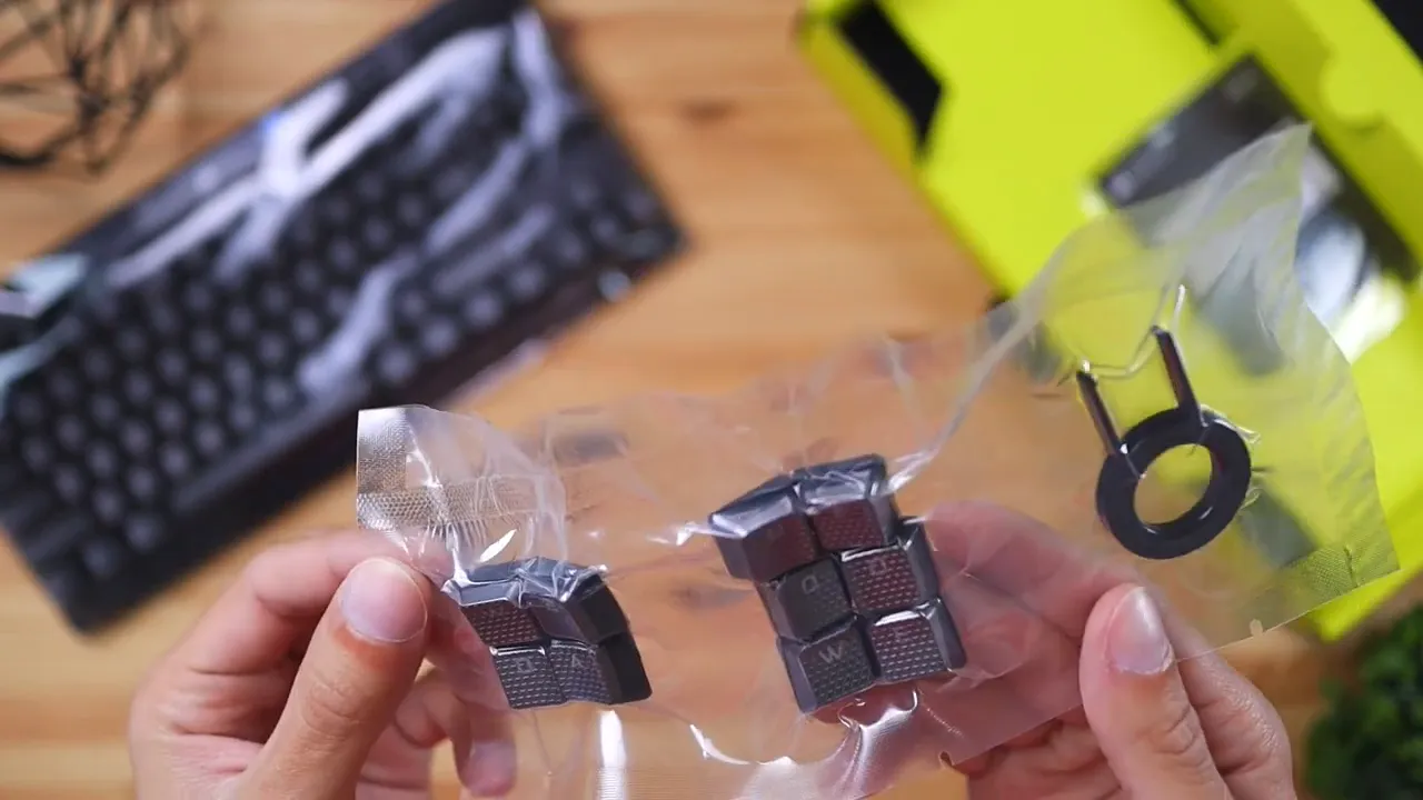 Packaged textured replacement WASD and QERF keycaps with a keycap puller for the Corsair K70 TKL