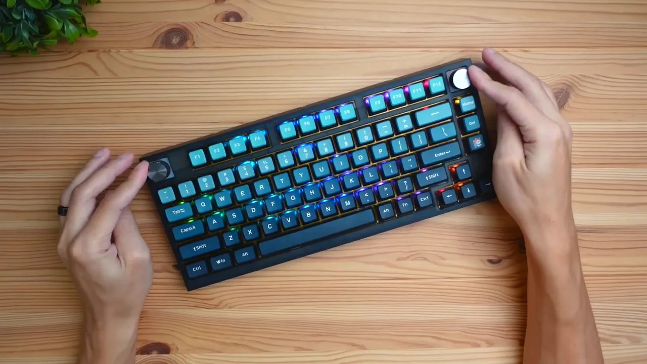 Top-right view showing dual knobs for volume and media control