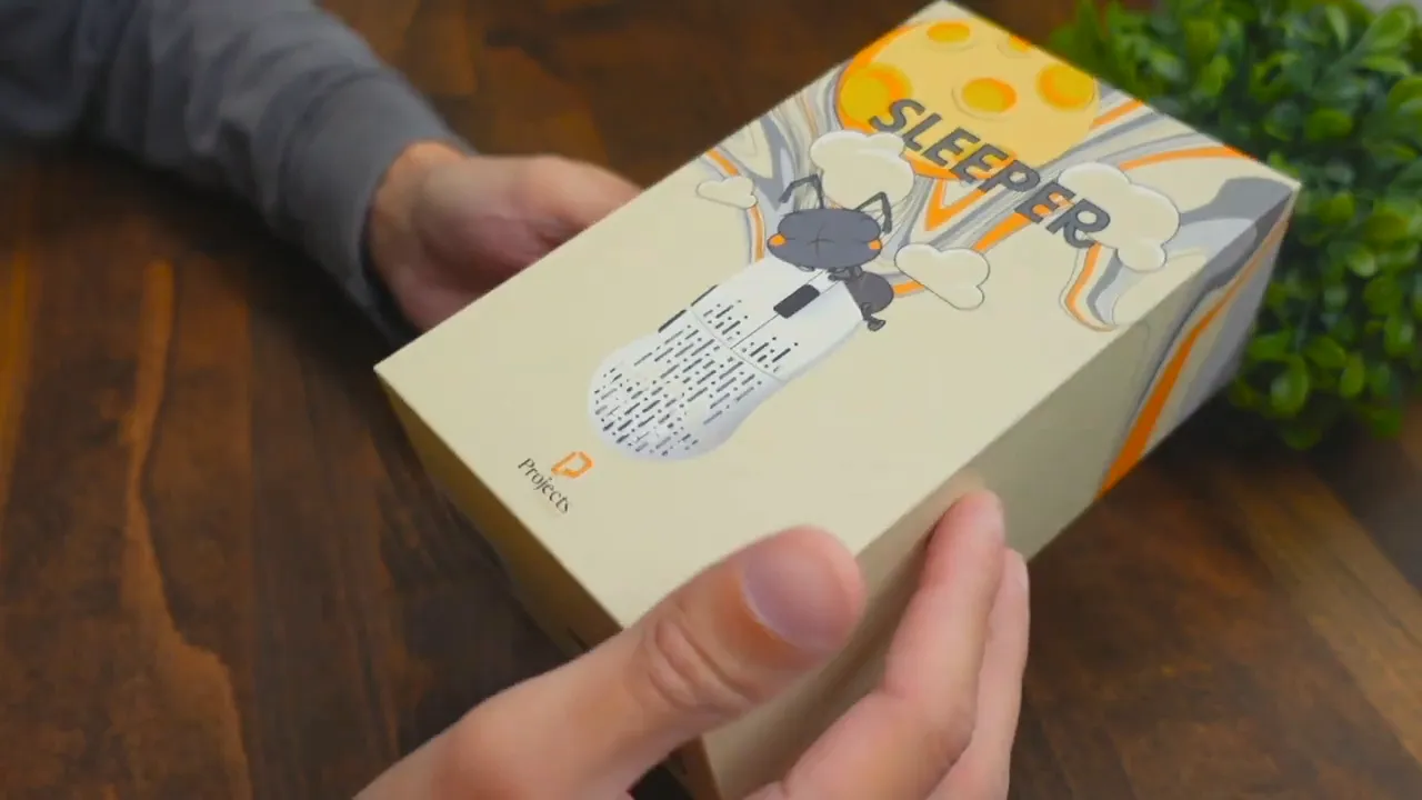 Projects Gaming Sleeper retail box with illustrated 'SLEEPER' artwork shown during unboxing
