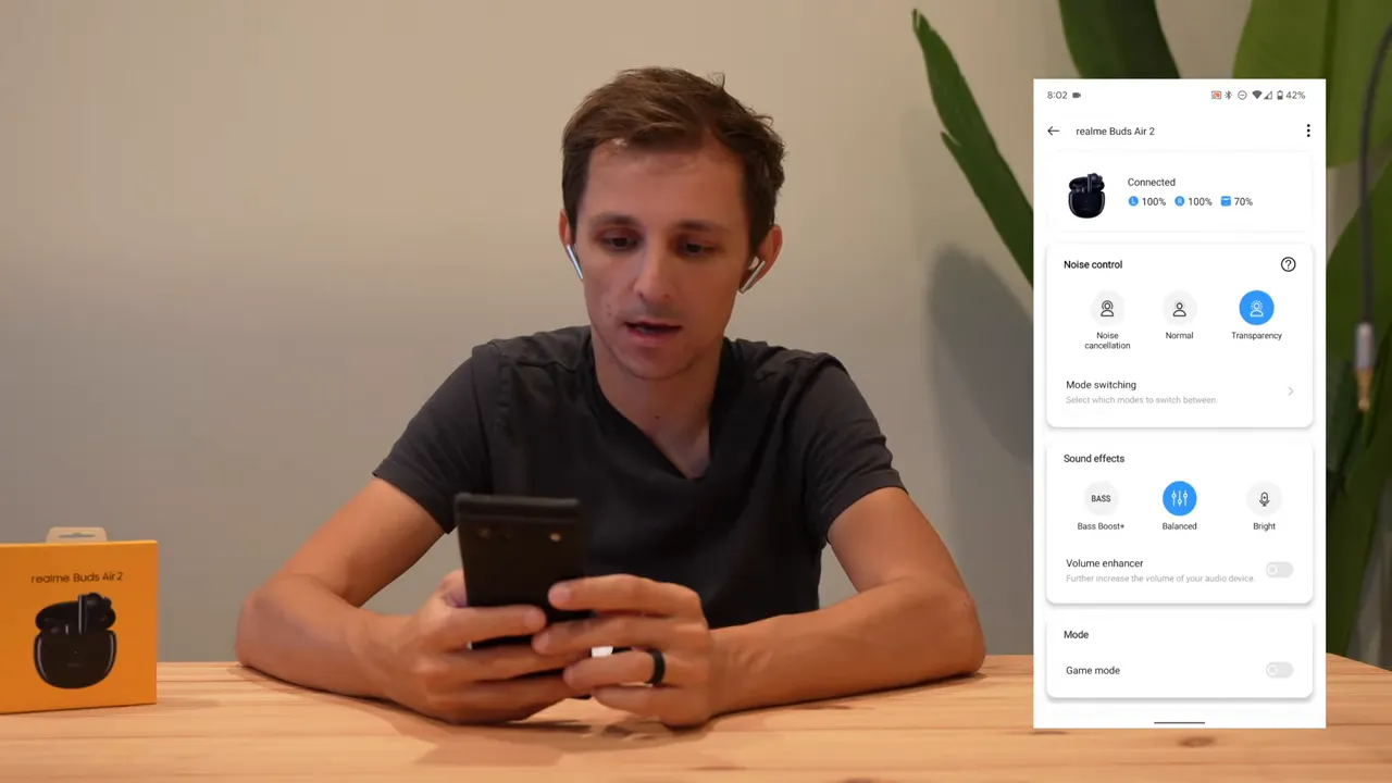 Realme Link app screen showing noise control, sound effects and game mode next to reviewer