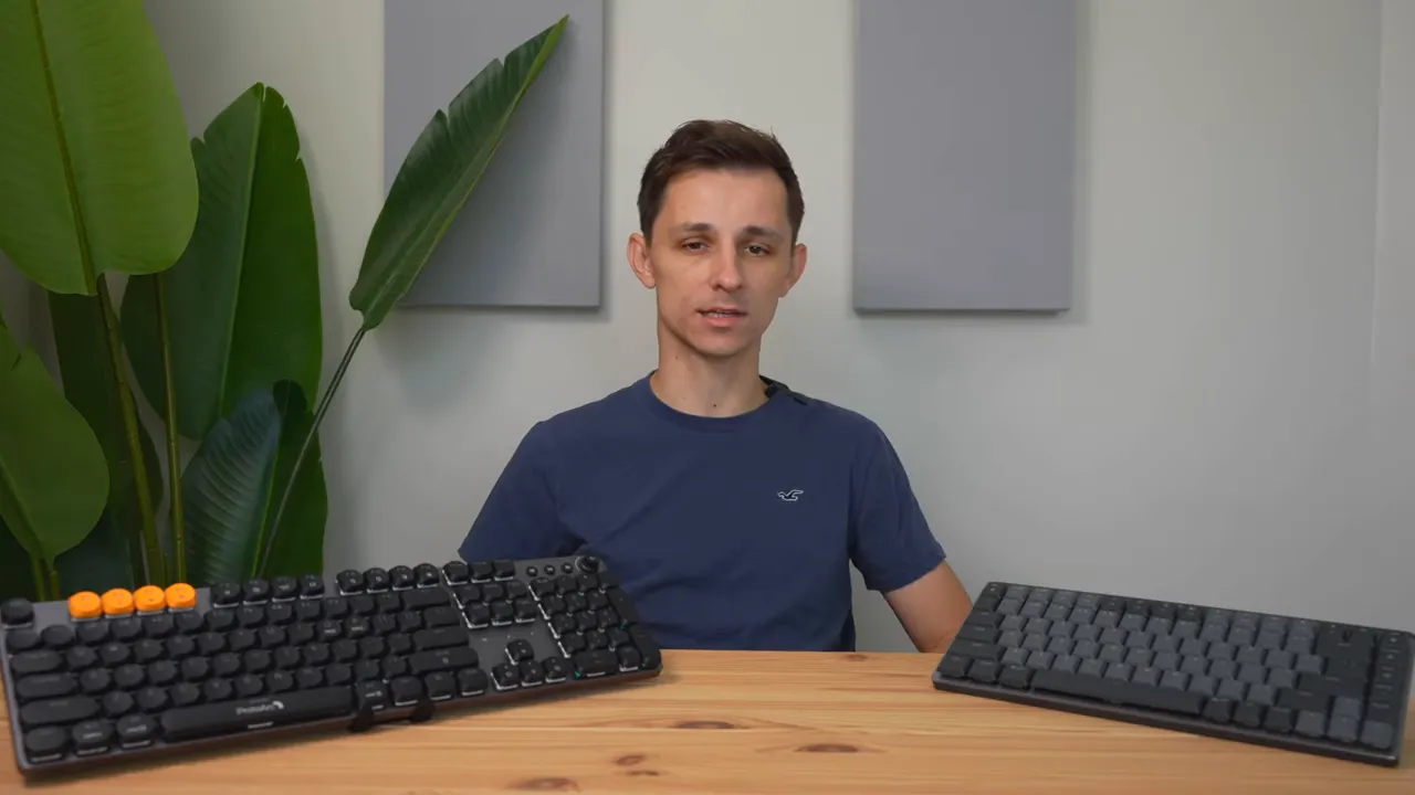 Front view of presenter with Logitech MX style keyboard on left and ProtoArc MECH K300 on right