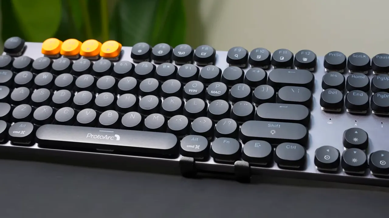 ProtoArc keyboard showing orange accent keys and round keycaps