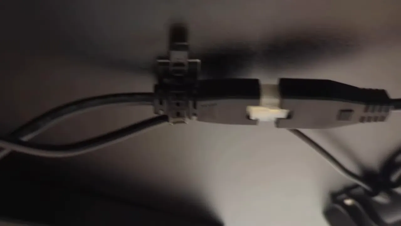 Cable management channel and headphone hook under desk
