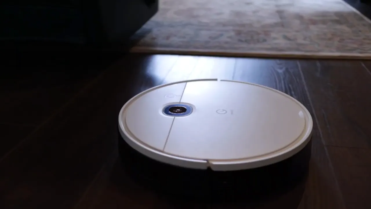 Yeedi robot vacuum on hardwood floor during a cleaning run