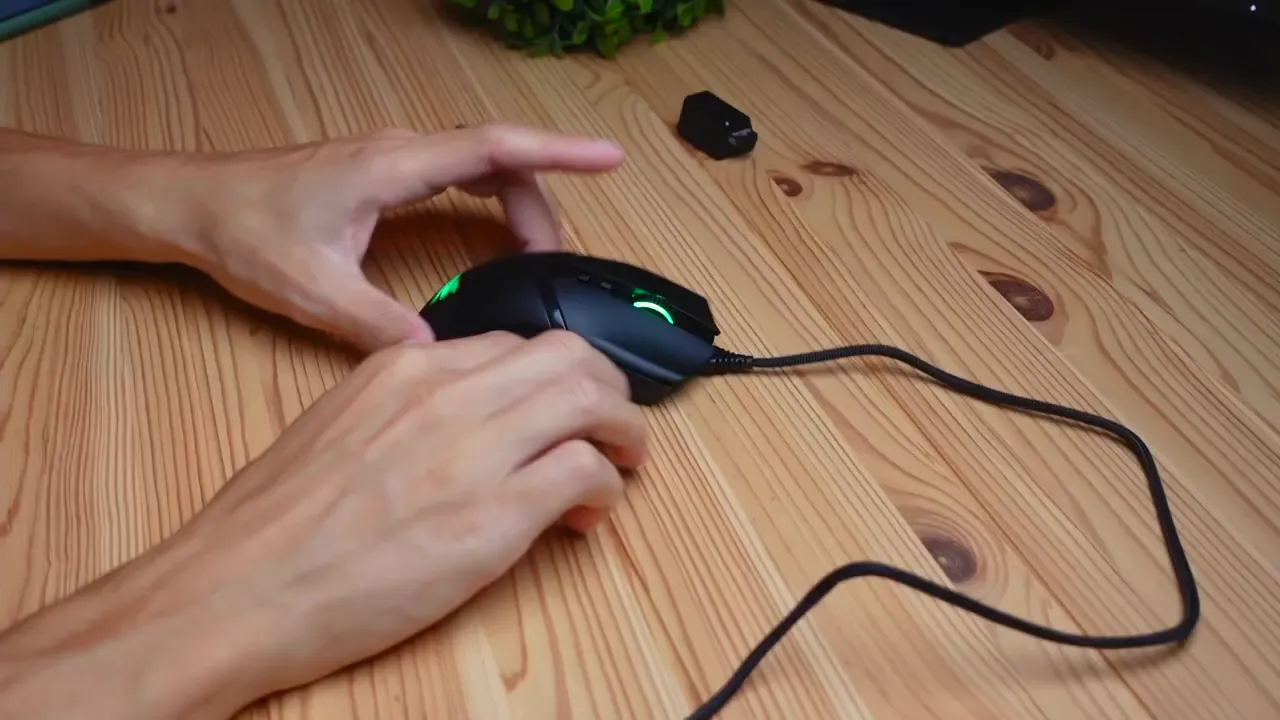 Cobra Pro lit up showing green RGB on logo, scroll wheel and shell