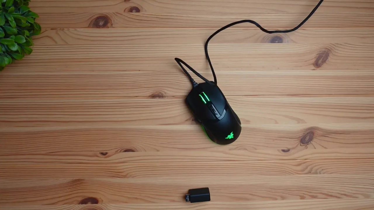 Razer Cobra Pro unboxed with receiver and dongle next to the mouse