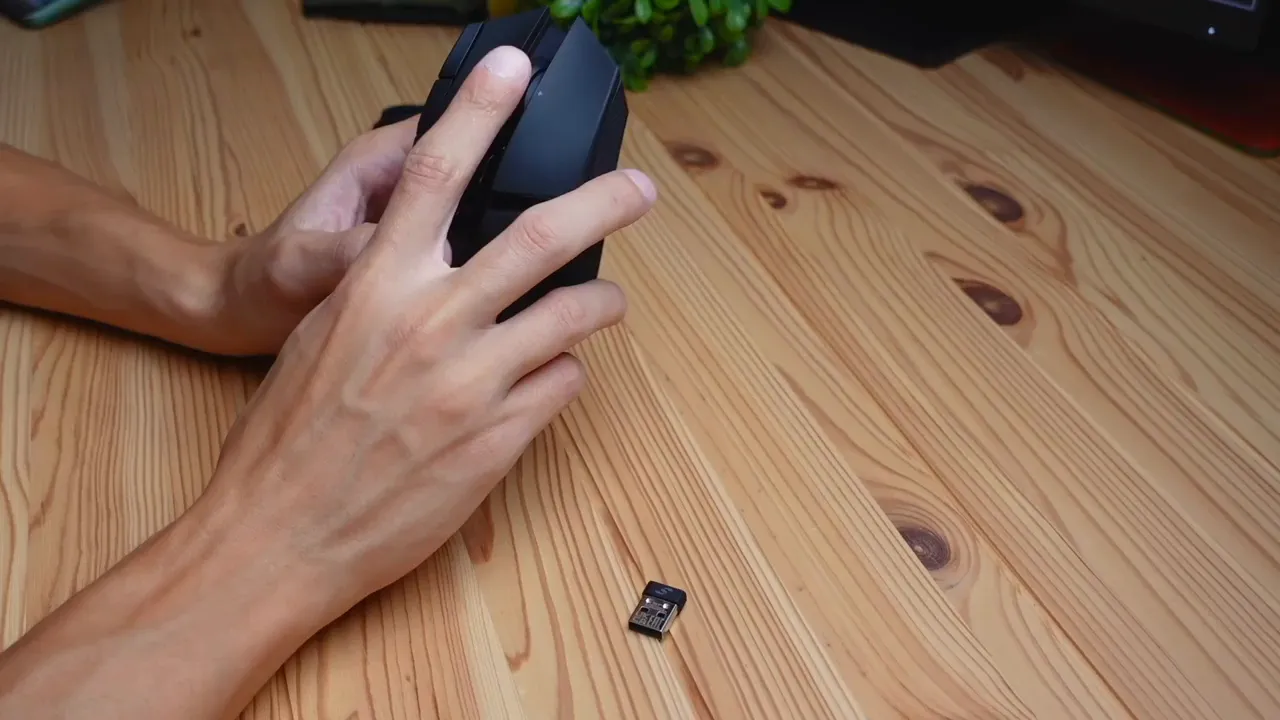 Close-up of the DARKSTAR's rubberized matte finish and scroll wheel