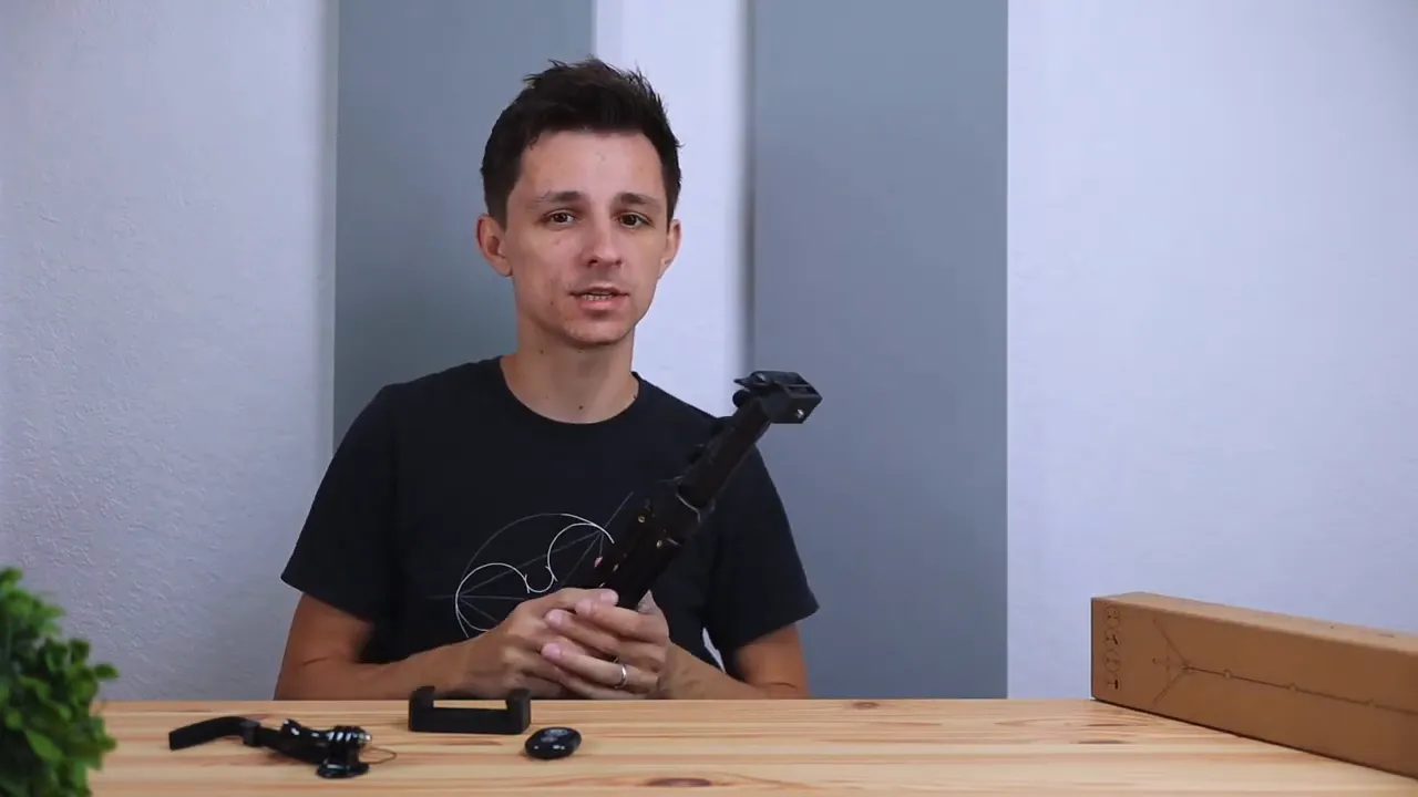 Ruittos tripod held to display collapsible leg sections and tripod head