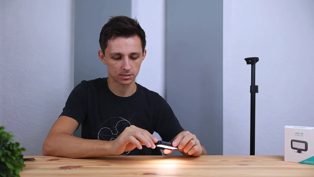 Movo LED-30 lighting a desk surface from a hand-held position
