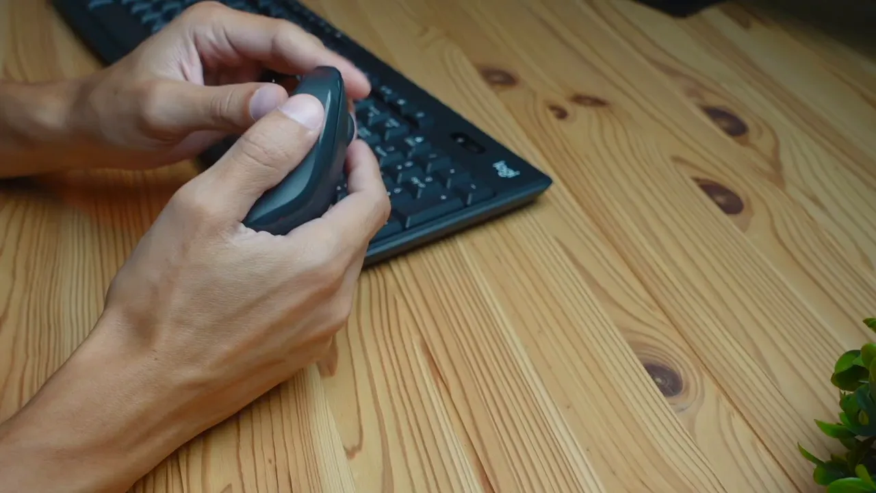 Close-up of the M240 mouse showing scroll wheel and buttons
