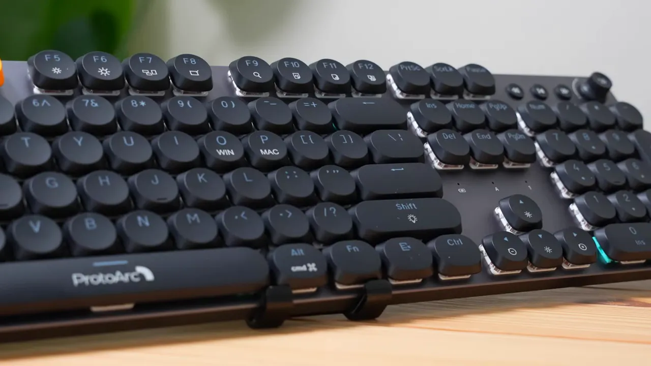 Clear angled view of the ProtoArc MECH K300 full-size keyboard with round keycaps and ProtoArc logo