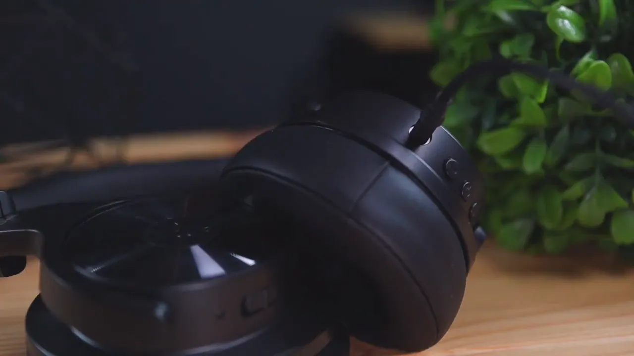 Cable inserted into the OneOdio A30 ear cup demonstrating wired connection