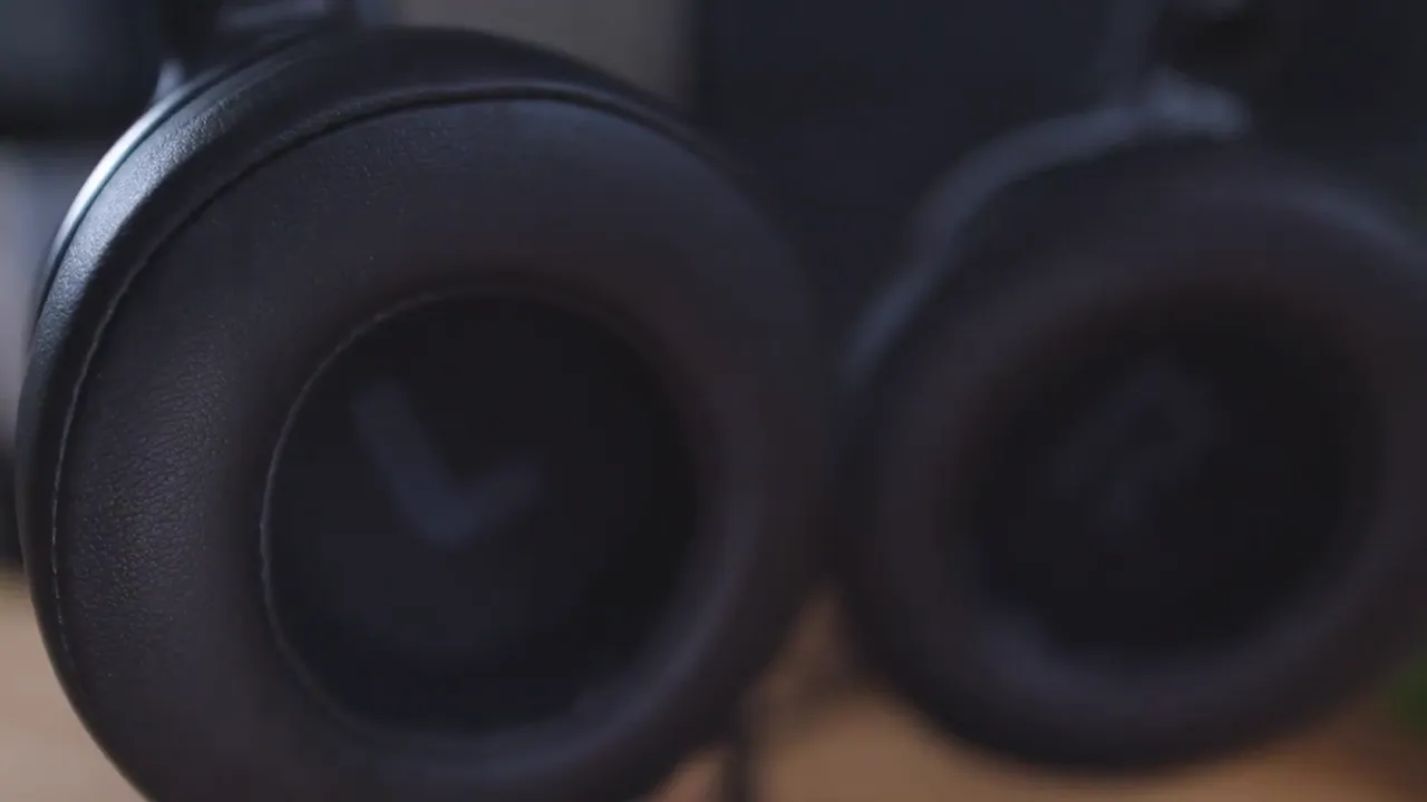 Close shot of OneOdio A30 ear cup showing leatherette texture and left channel marking