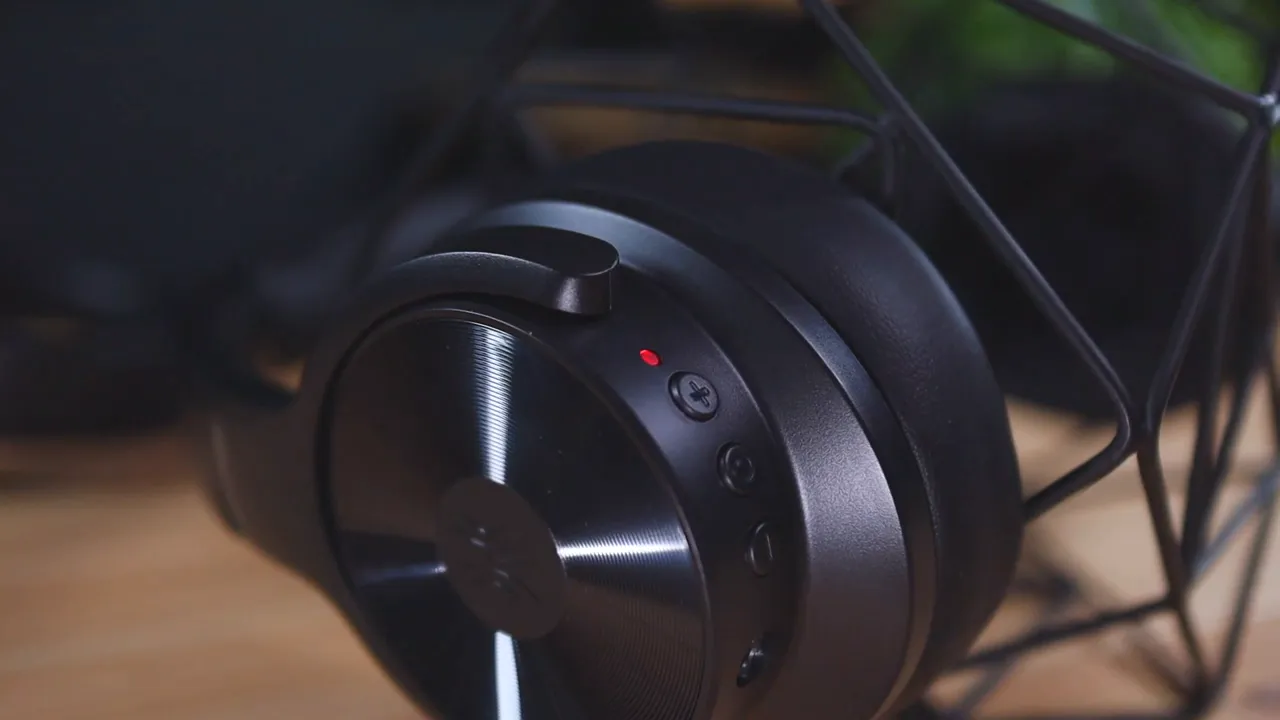 Close-up of the OneOdio A30 right ear cup showing volume buttons, ANC button, and LED indicator