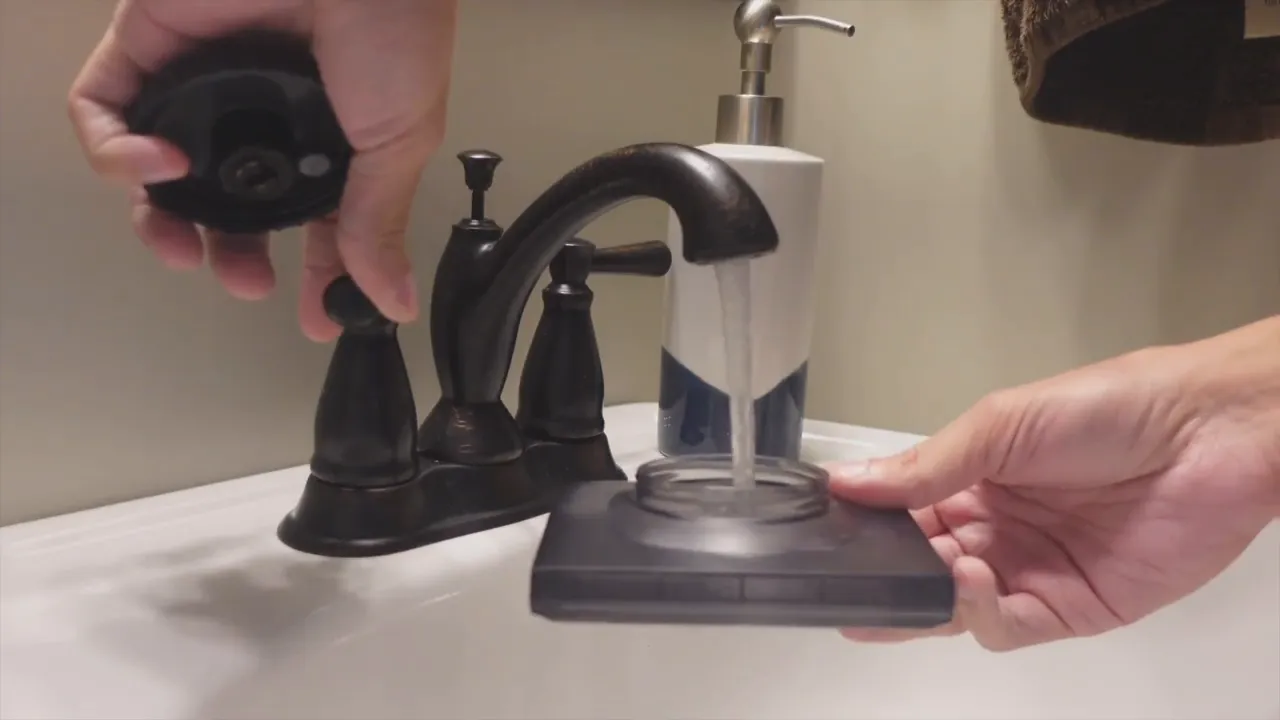 Filling the EVERYBOT Edge2 water cartridge under a running faucet