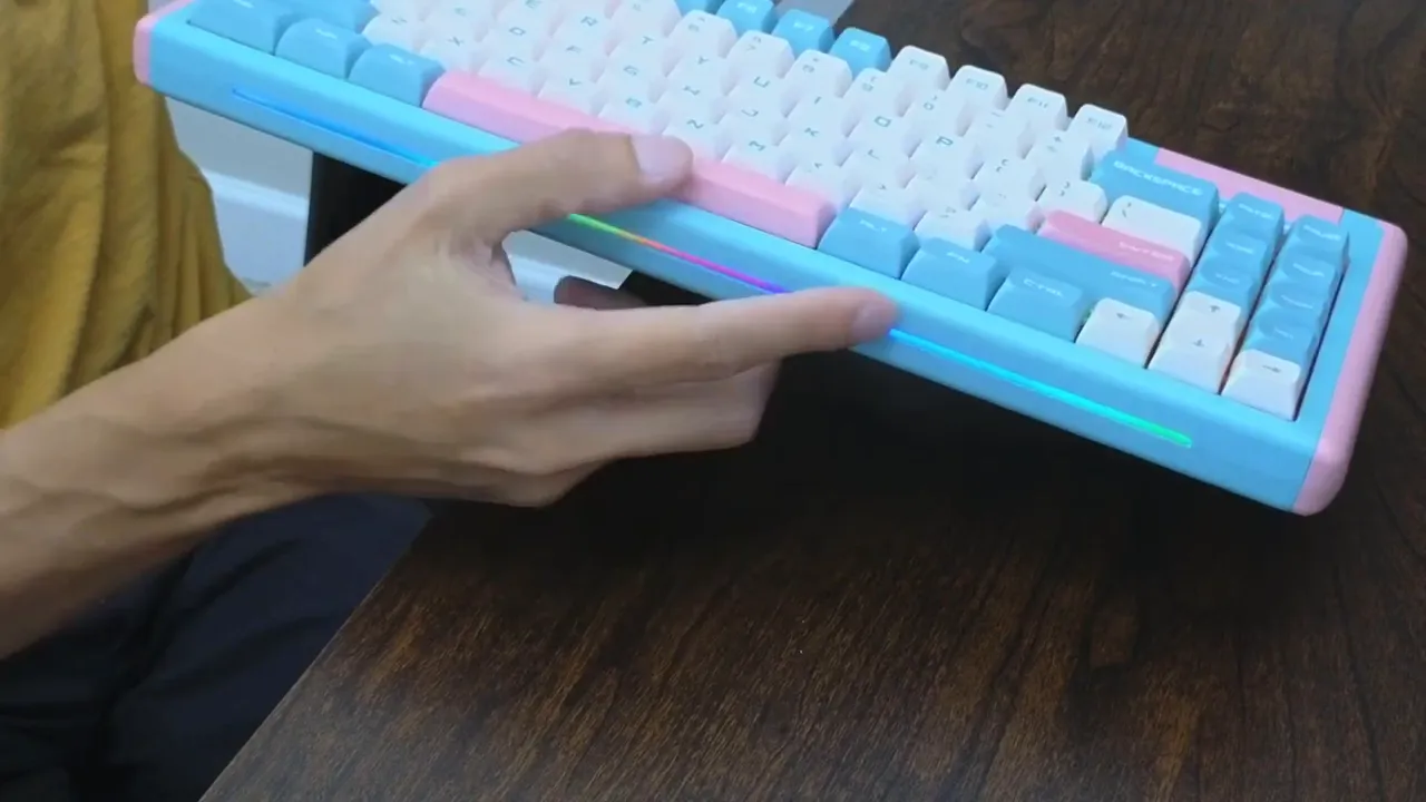 Finger pointing at DUSTSILVER D84 LED accent strip and RGB underglow on the keyboard's side