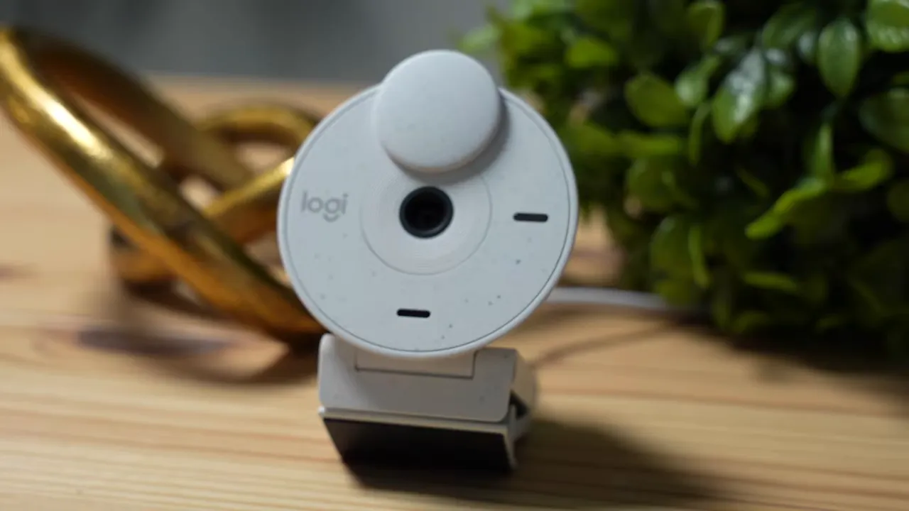 Straight-on Logitech Brio 300 showing privacy shutter and textured finish