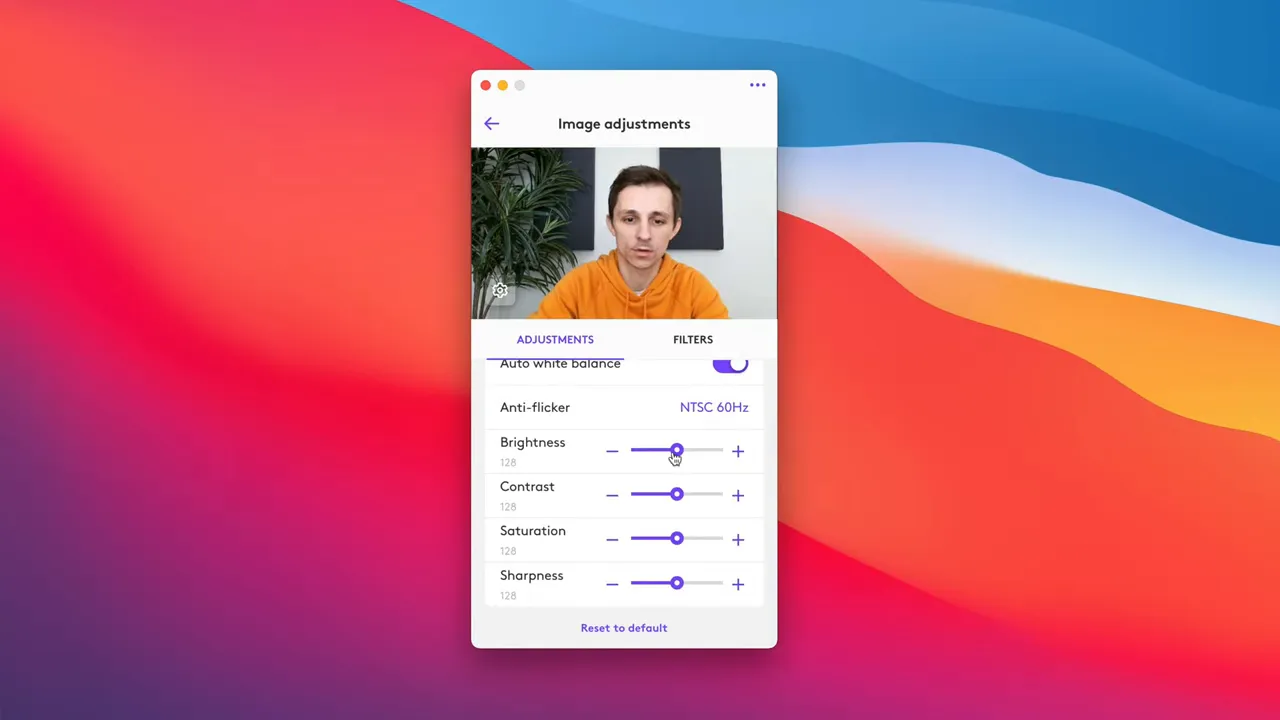Logitech Tune app open to Image Adjustments showing sliders for brightness, contrast, saturation and sharpness with webcam preview.