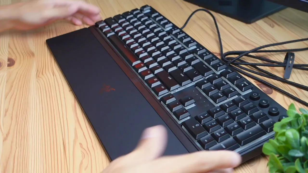 Magnetic wrist rest attaching to keyboard