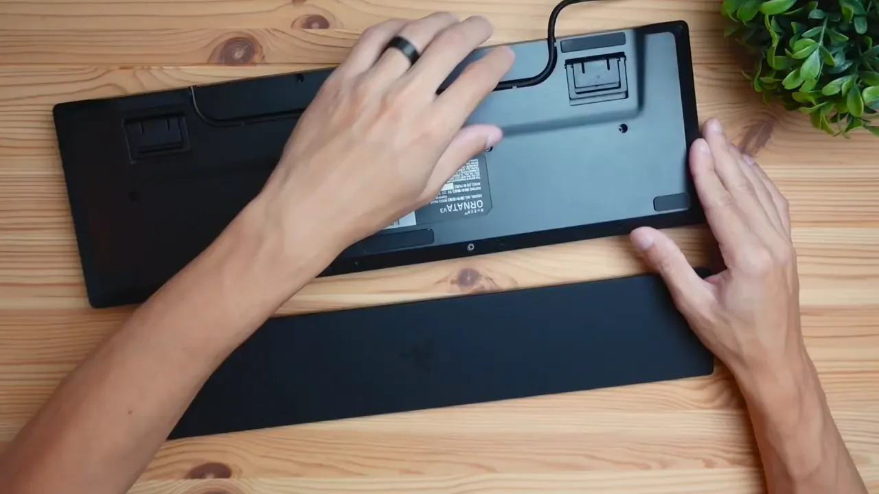Back of keyboard showing cable routing and rubber feet
