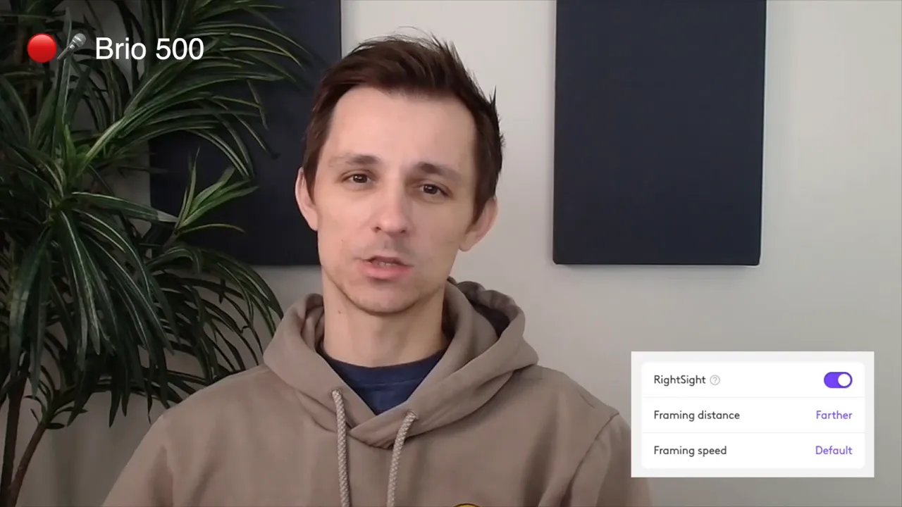Brio 500 RightSight auto-framing demo with the settings panel showing Framing distance set to Farther and Framing speed set to Default.