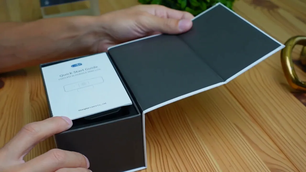 Open Coolpo Mini Lite box showing the quick start guide and inner packaging