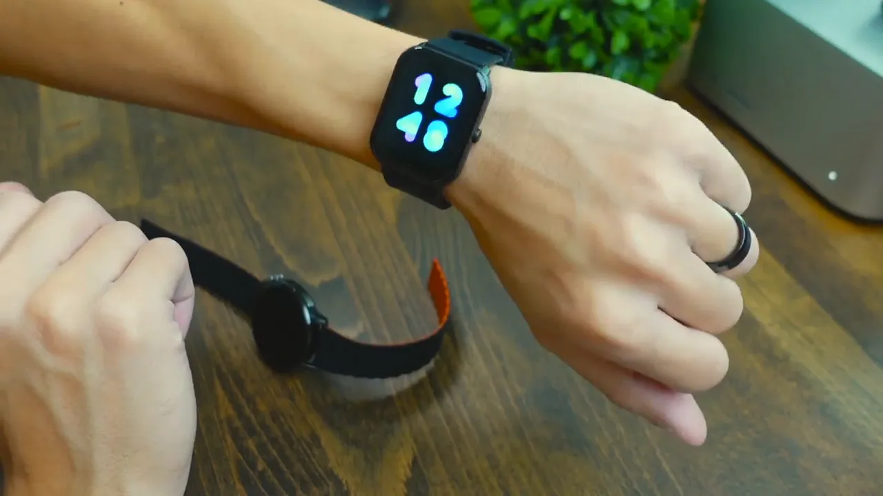Imilab W01 smartwatch on wrist with screen on after the strap is latched