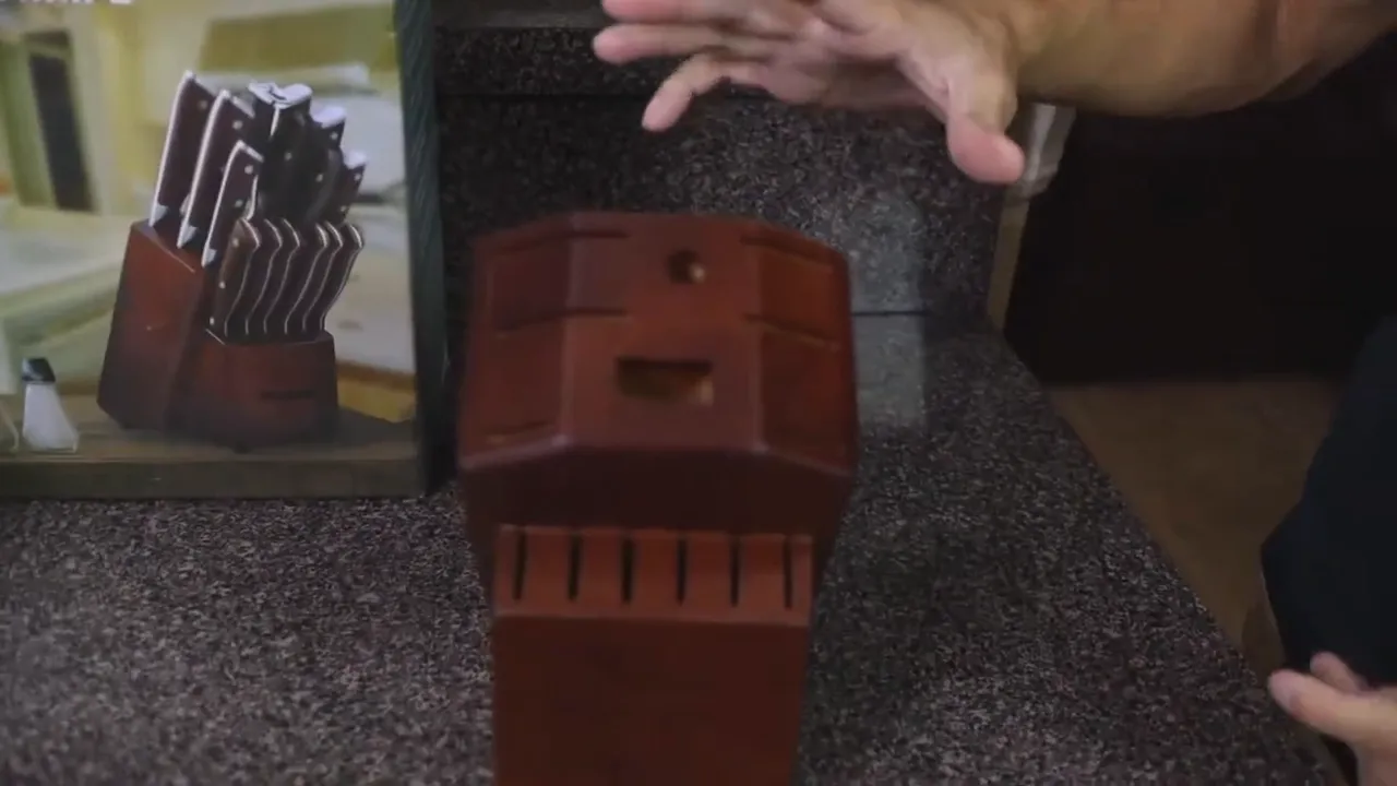 Wooden knife block standing on the countertop before the knives are inserted