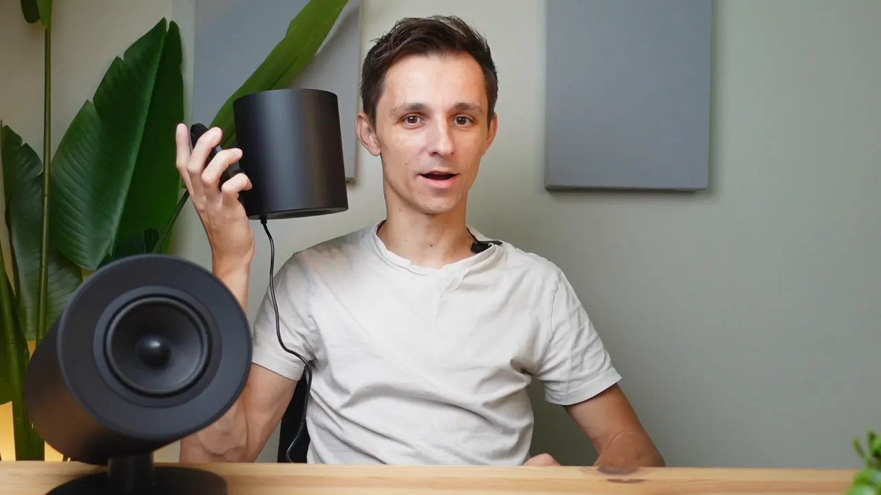 Speaker next to person's head for size comparison