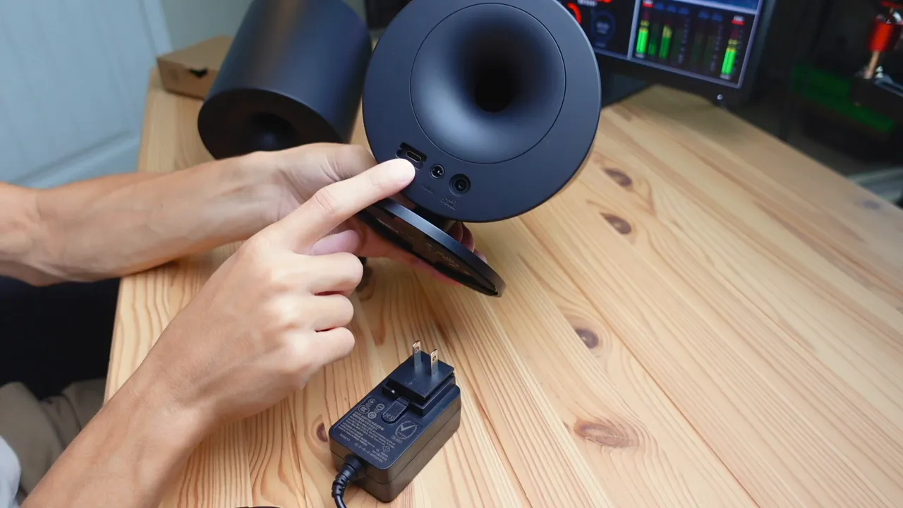 Back of speaker showing USB-C, power port, and speaker-to-speaker port