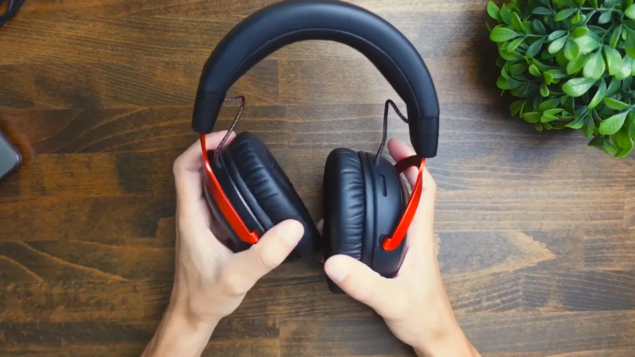 Full headset on desk with red accents and HyperX logo