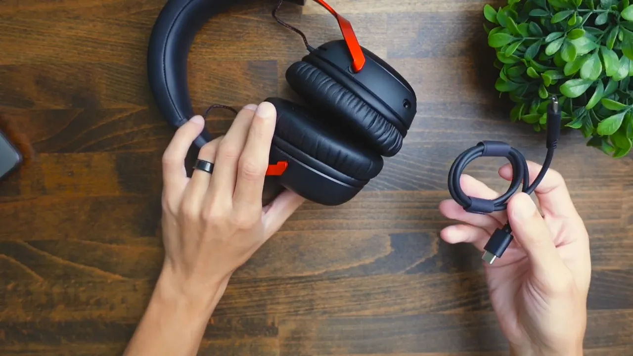 USB-C charging cable next to the headset