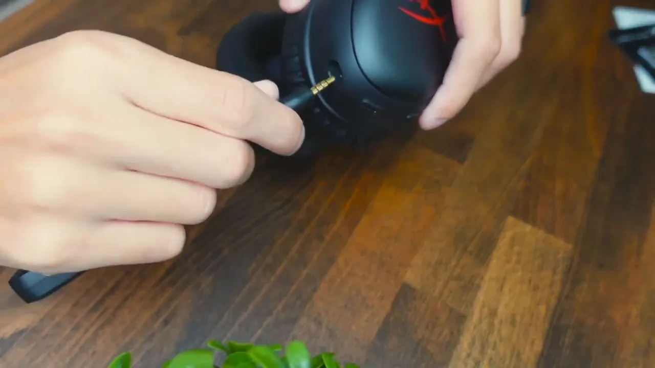 Headset plugged into PC with music playing