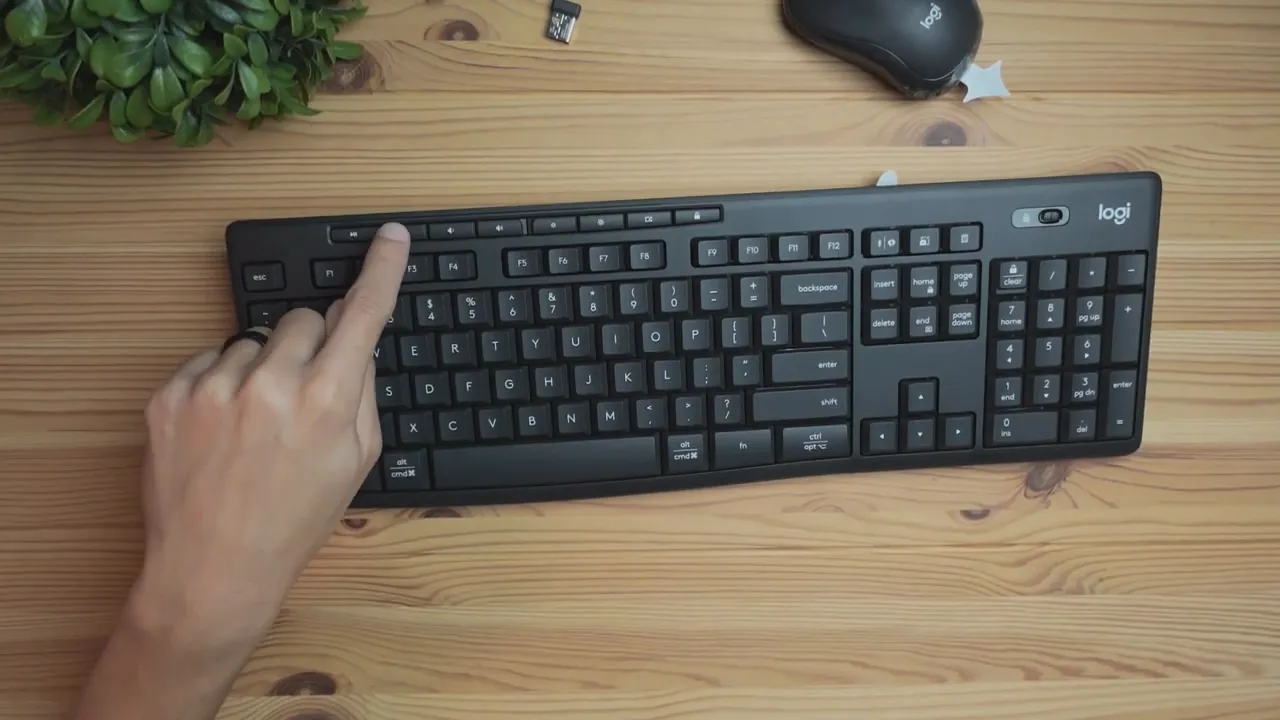 Finger pointing to MK370 keyboard top row media and shortcut keys