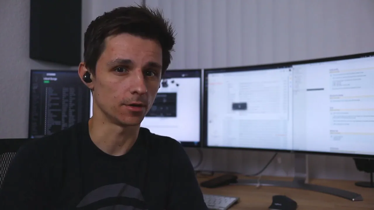 Close view of reviewer with JBL Reflect Mini NC earbuds in place, showing mic position