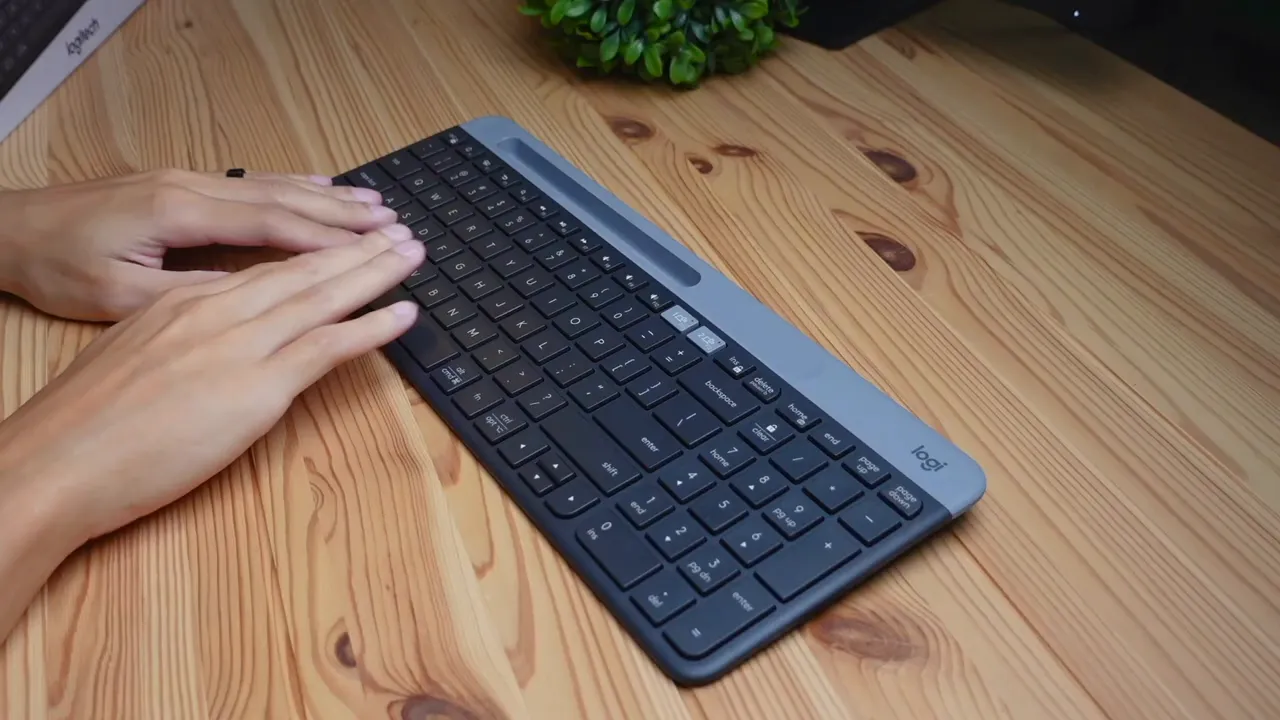 side profile showing slim design and number pad