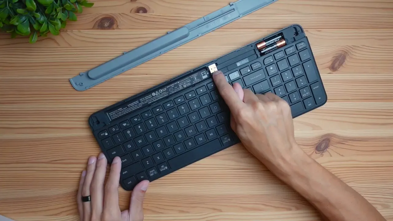 keyboard box opened with small gray tab and compartment visible