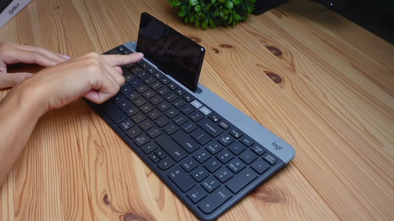 phone placed in the keyboard's built-in phone mount, phone in landscape mode