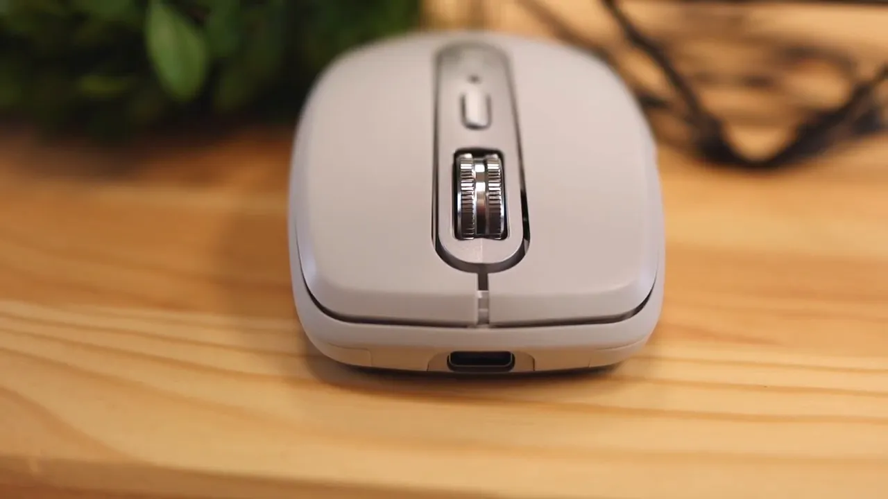Front view of the pale gray mouse showing metal scroll wheel and USB-C port