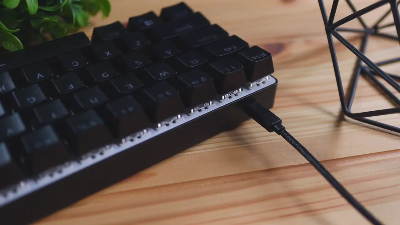 Braided USB-C cable connected to the side of a Whirlwind FX Atom 60% mechanical keyboard