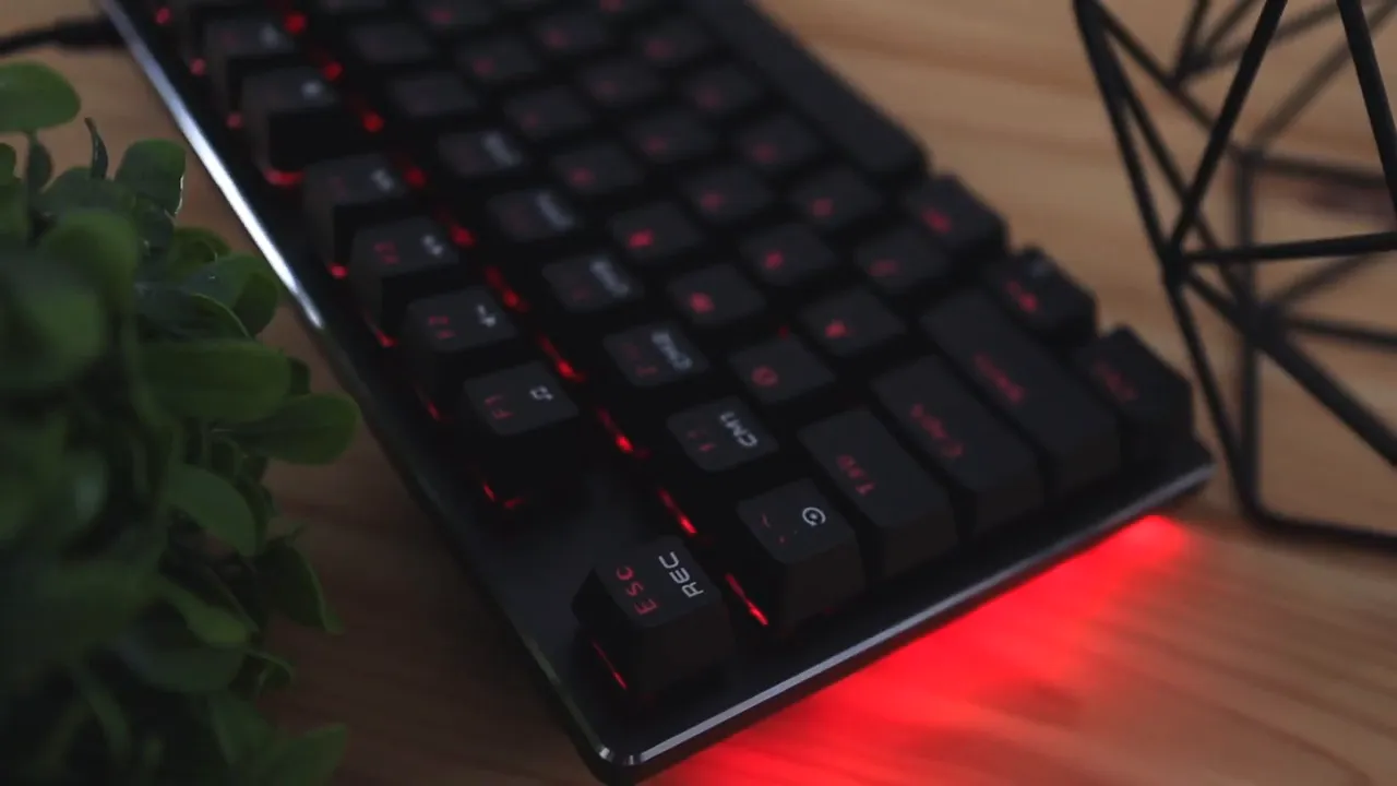 Close-up of Marvo KG934 keyboard keys with red RGB lighting and side glow