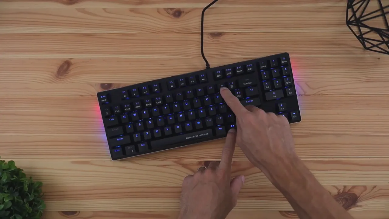 Marvo KG934 mechanical keyboard RGB lighting on the desk with hand pressing keys