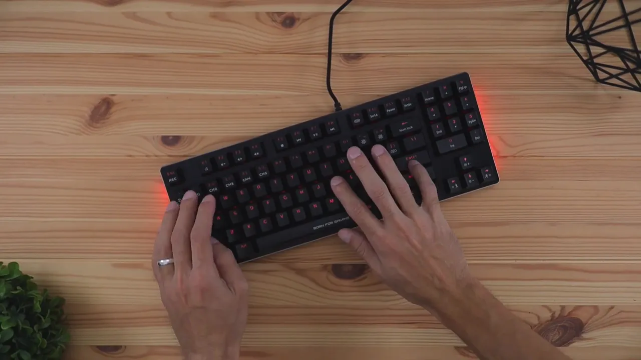 Hands typing on Marvo KG934 mechanical keyboard from above