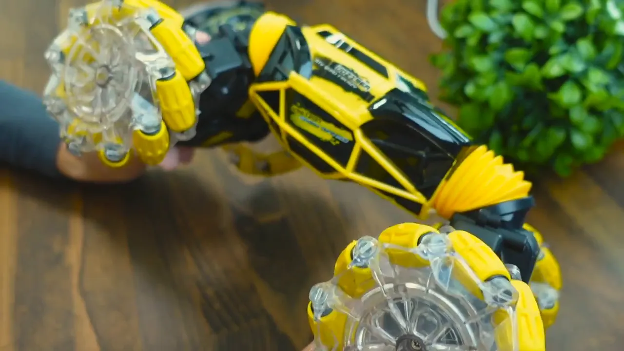 Close-up of DoDoeleph RC car showing its flexible bionic-style spine and transparent mecanum-style wheels on a tabletop