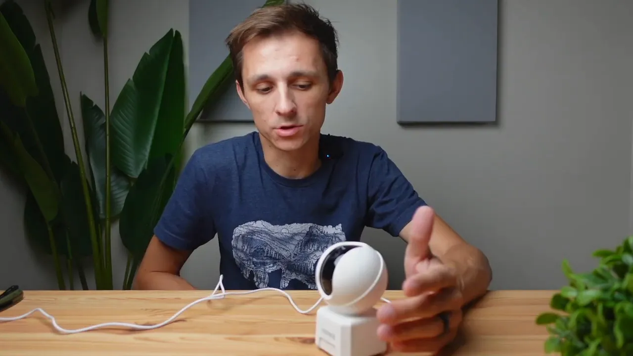 Annke Creator Pro mounted on base on table with power cable ready for app setup