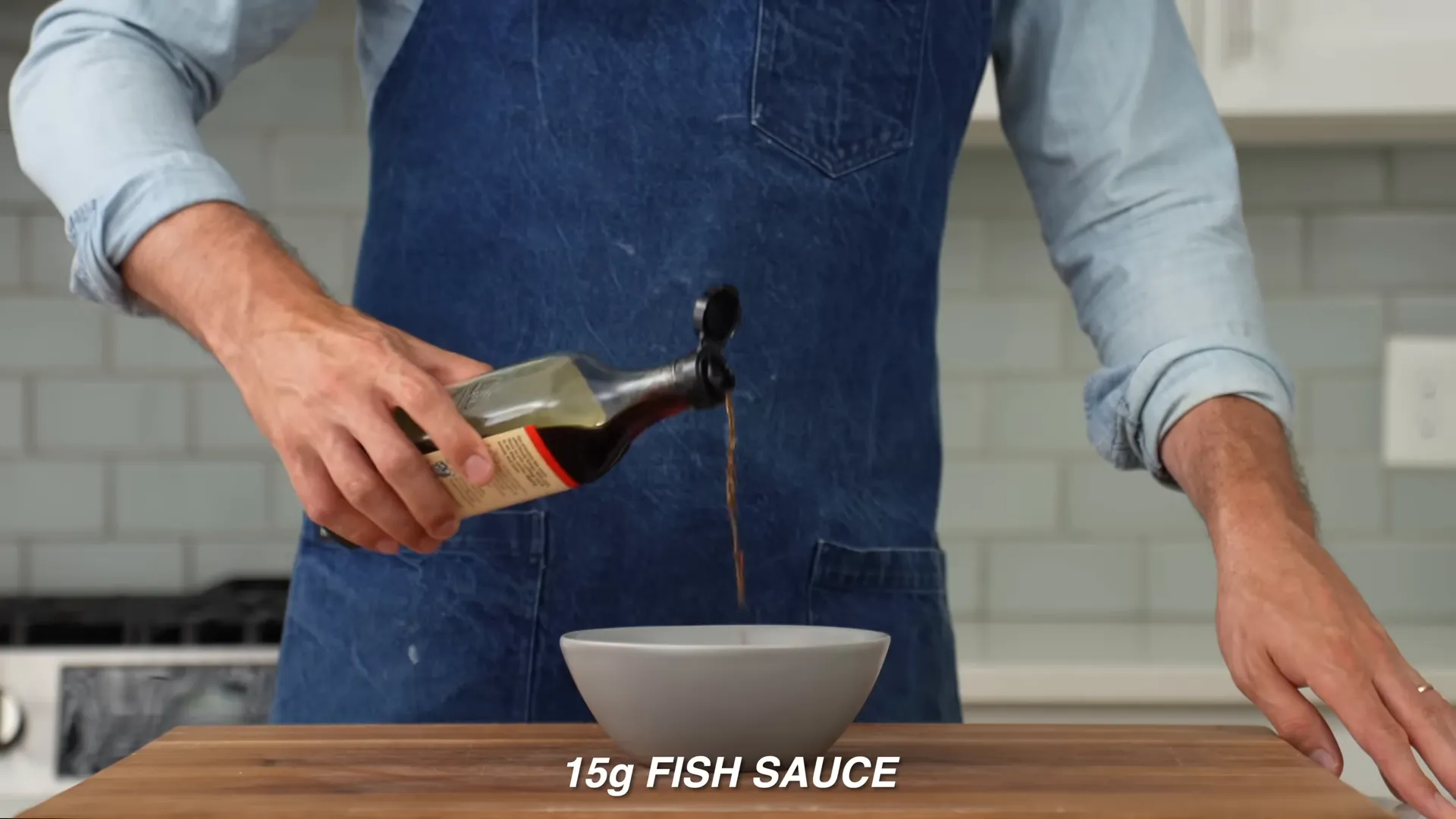 Mixing pad Thai-style sauce in a bowl